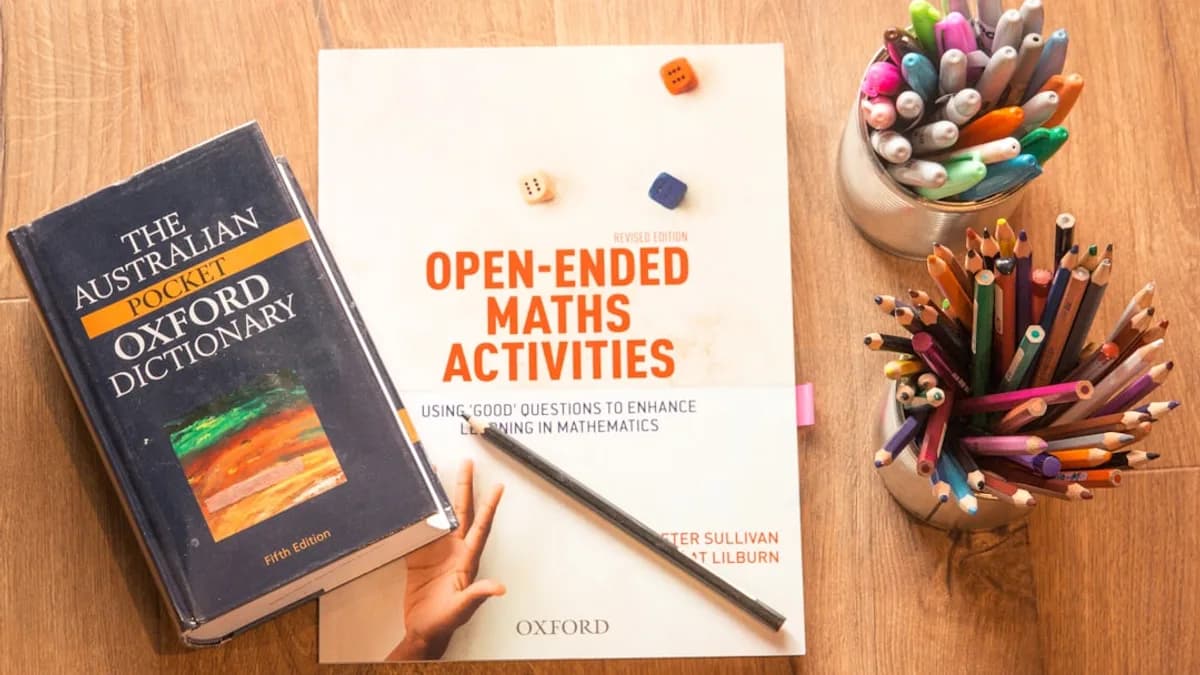person holding a book and pen