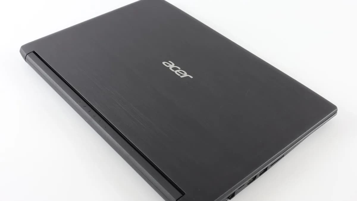 a laptop computer sitting on top of a white table