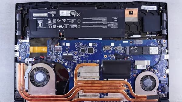 the motherboard of a laptop is being dismantled