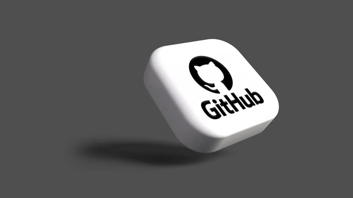 a white dice with a black github logo on it
