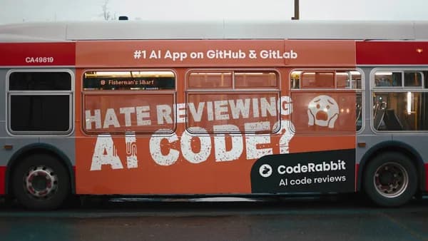 Bus advertisement for coderabbit ai code reviews.