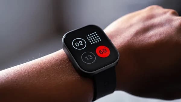 a close up of a person wearing a smart watch
