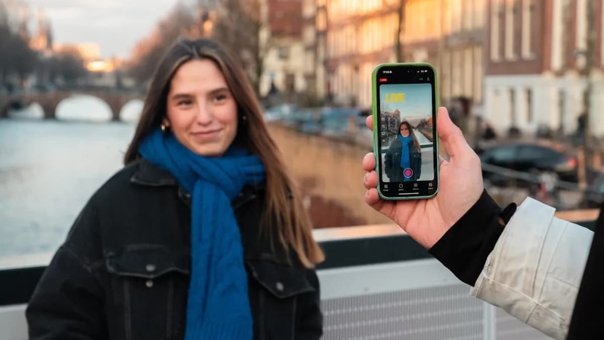 Woman posing for a selfie in front of a canal