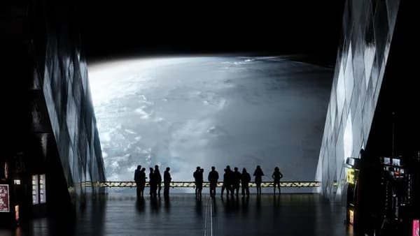a group of people standing in a dark room