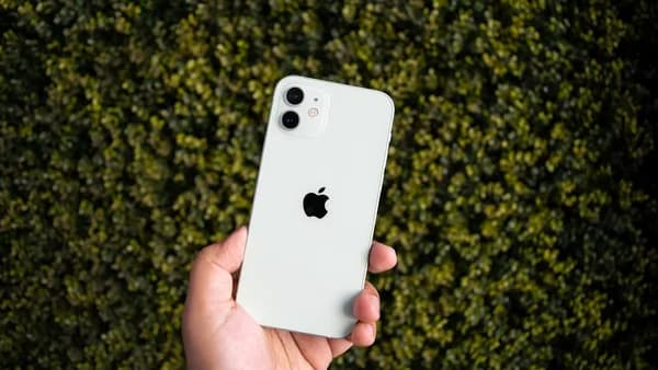 white iphone 4s held by person