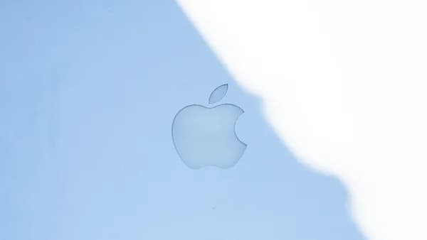 The apple logo on a blue surface.