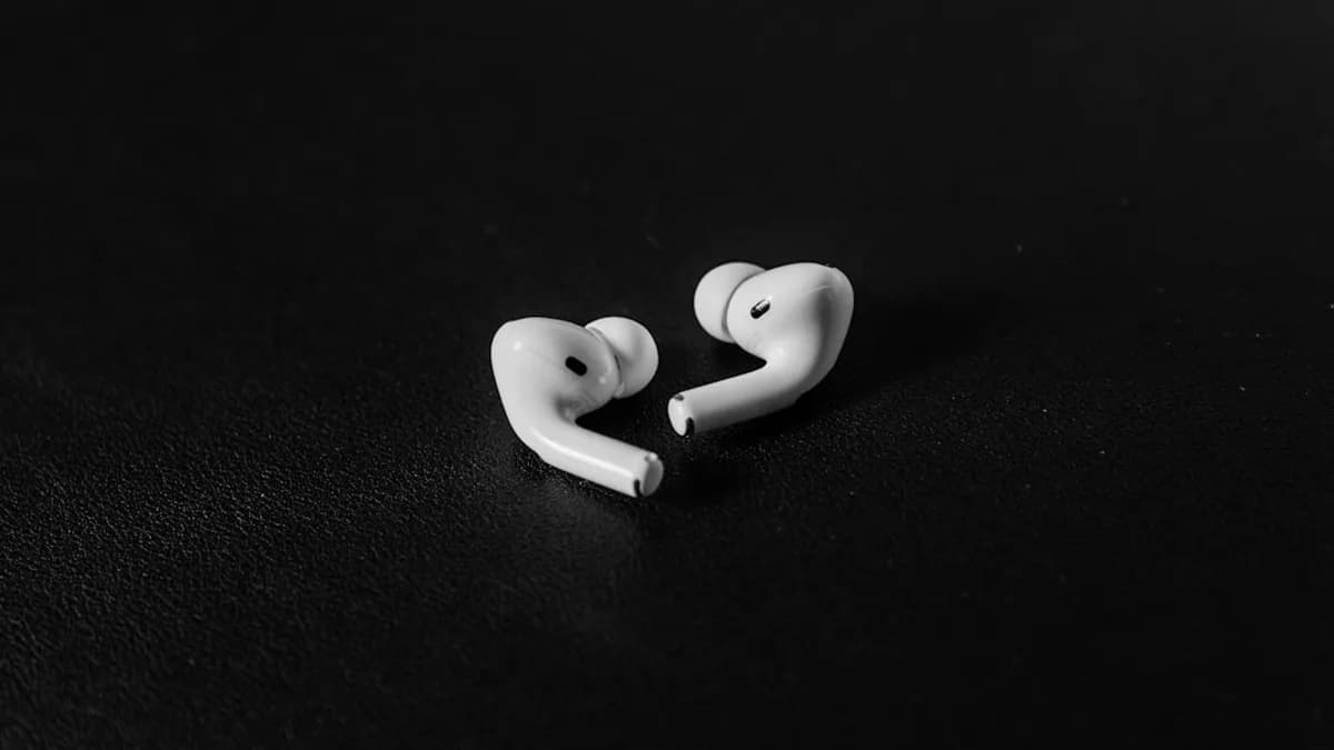 a pair of ear buds sitting on top of a table