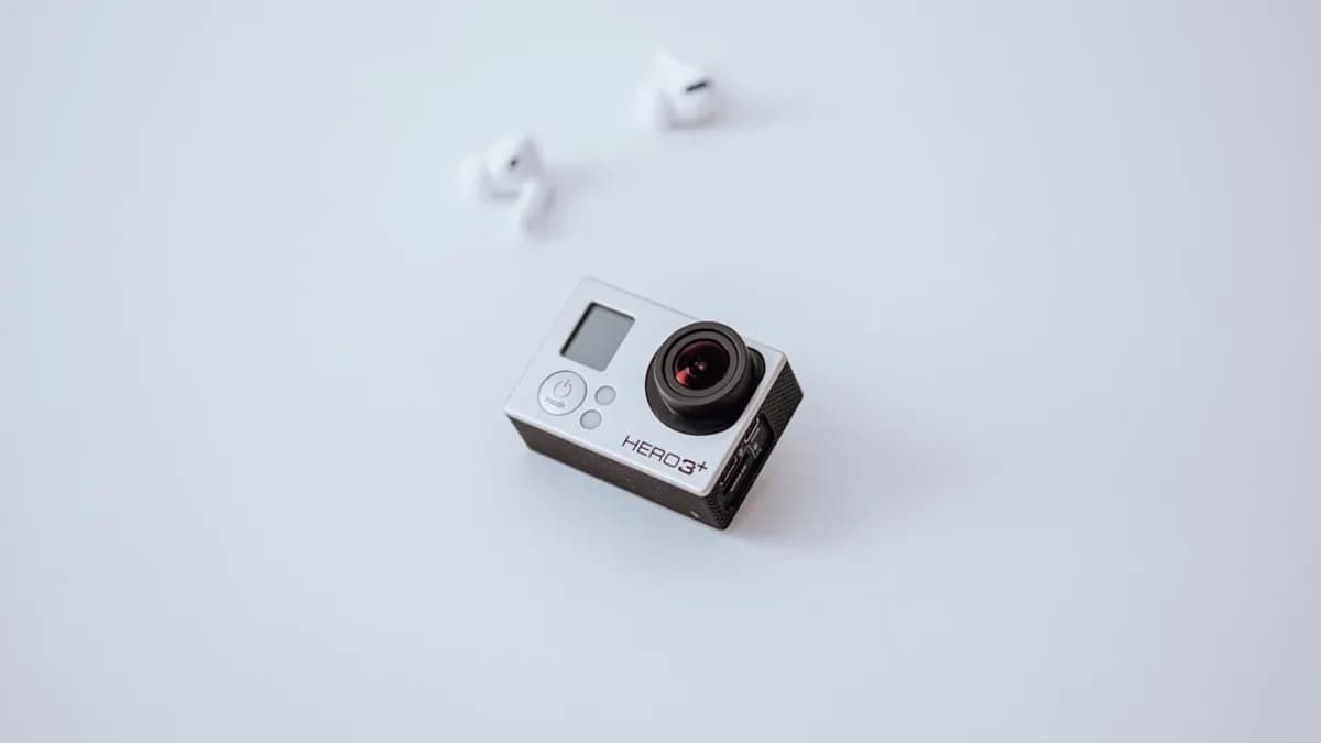 white and black camera on white surface