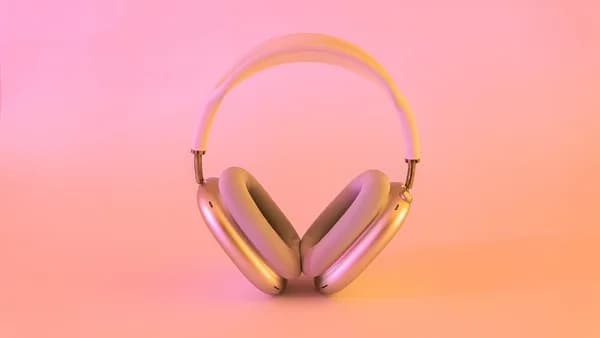 pink and white wireless headphones
