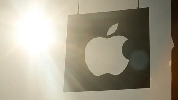 a picture of an apple logo hanging on a wall