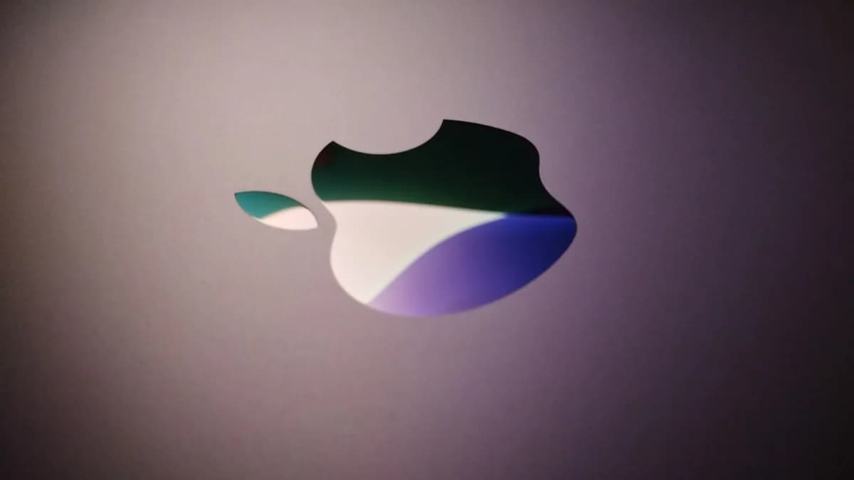 Close-up of an apple logo with colorful reflections