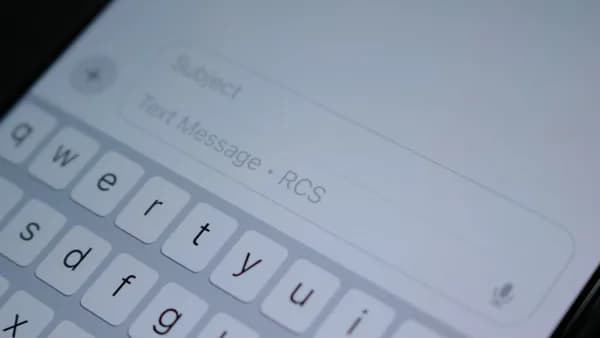 A close up of a cell phone with a keyboard
