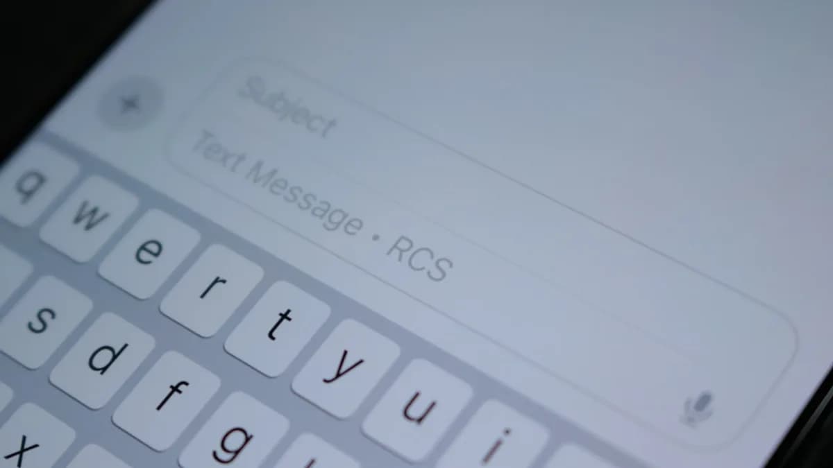 A close up of a cell phone with a keyboard