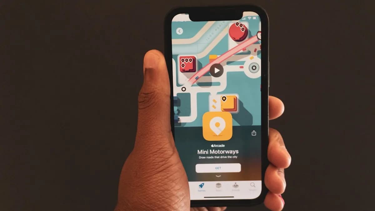 a person holding a smart phone in their hand