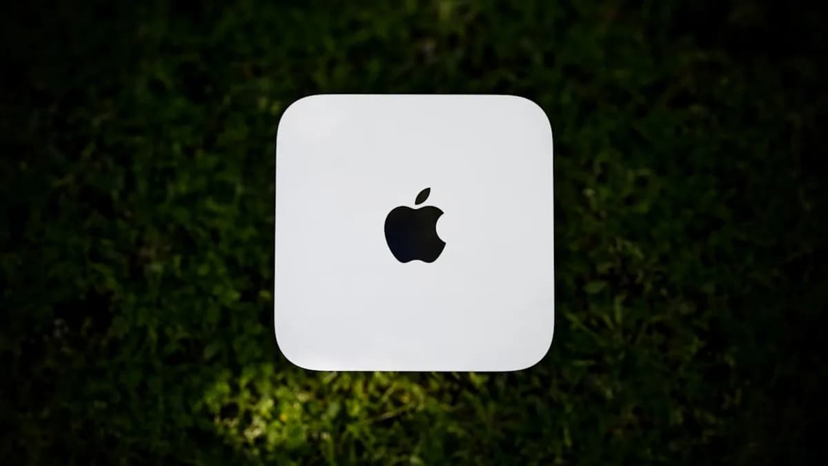 White apple computer on green grass