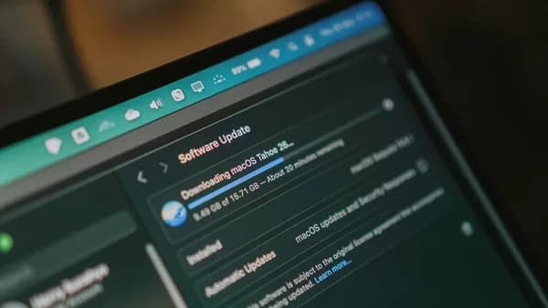 Macbook screen shows macos software update downloading