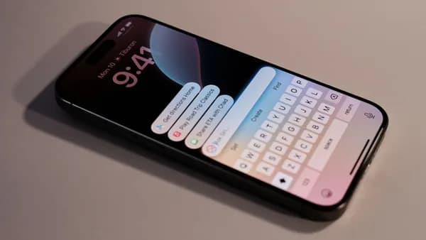 A close up of a cell phone with a keyboard on it