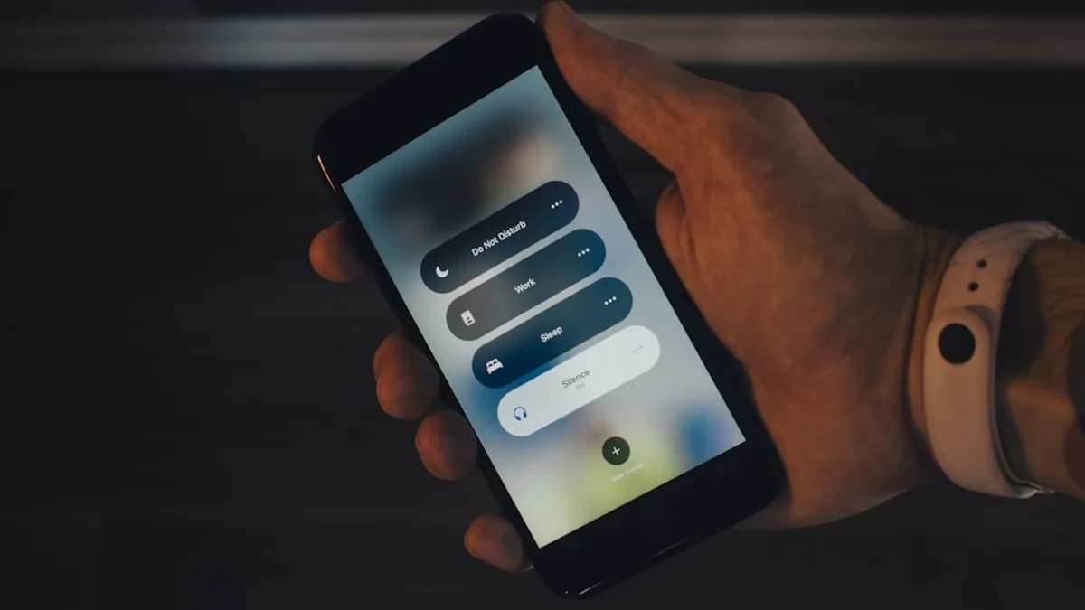 a person holding a smart phone in their hand