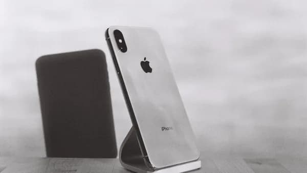 silver iPhone X on stand