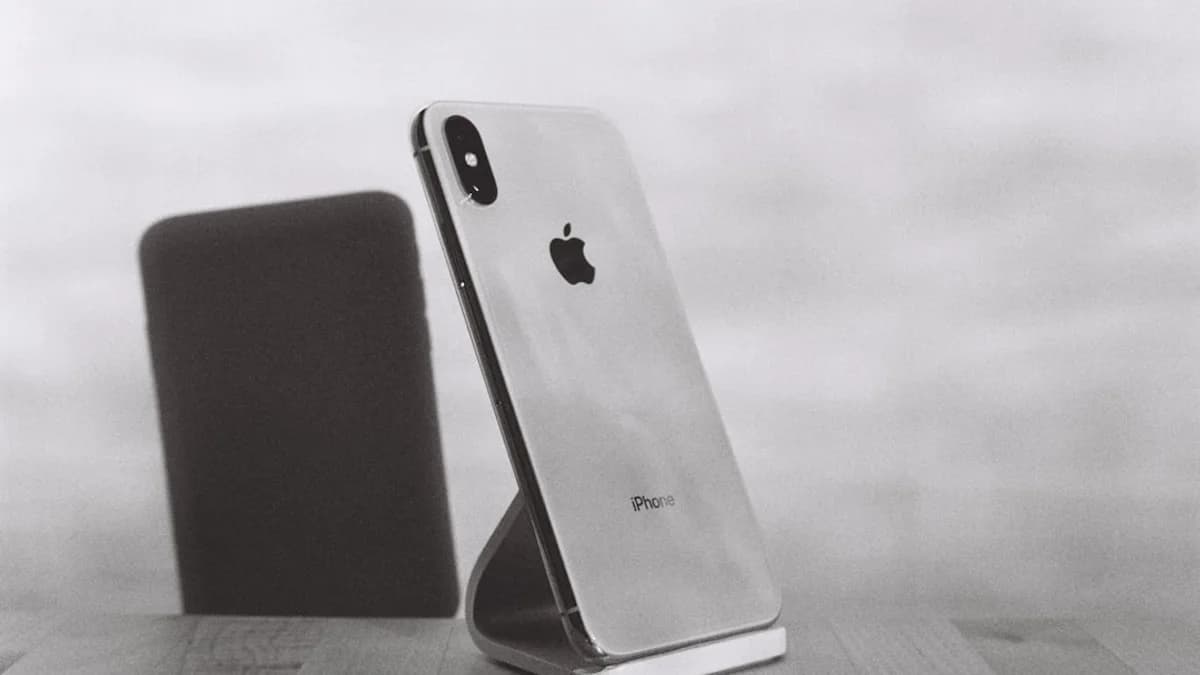 silver iPhone X on stand