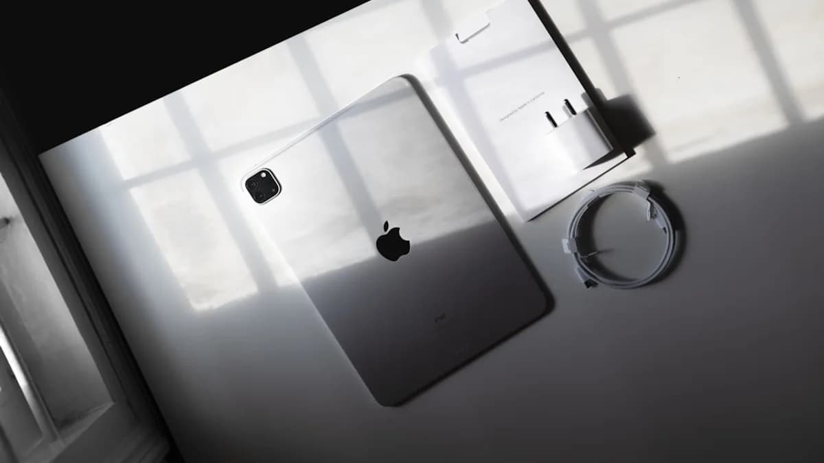 an apple product is displayed on a white surface