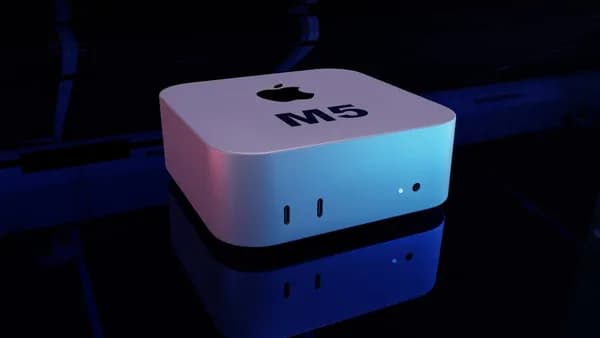 Apple mac mini m5 computer on a reflective surface.