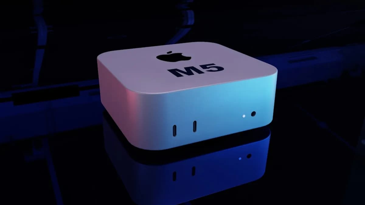 Apple mac mini m5 computer on a reflective surface.