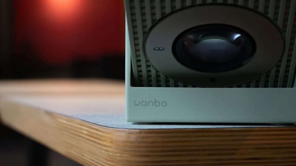 Close-up of a vintage speaker on a wooden surface.