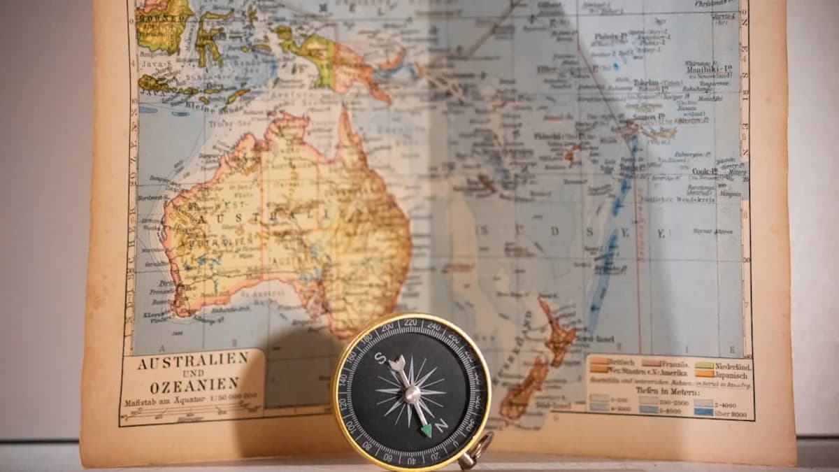 round gold and black compass and map chart