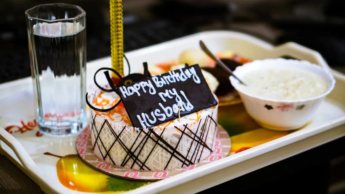 A plate with a cake and a glass of water