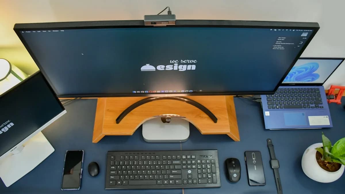 a desk with a computer and a phone