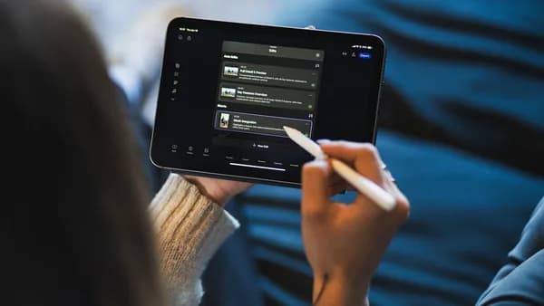 Person using a stylus on a tablet screen