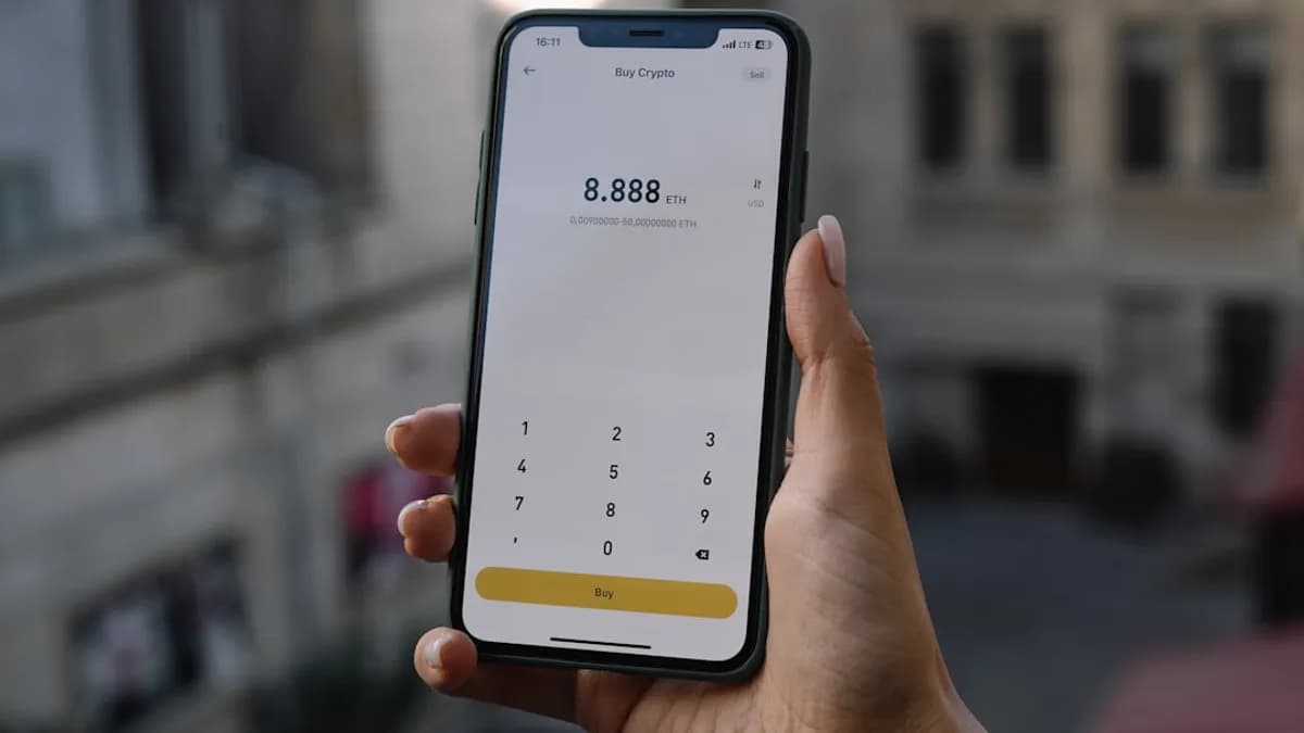 a person holding a cell phone in their hand