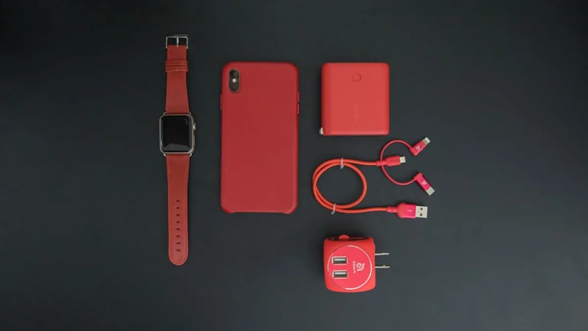 red iPhone and red smartwatch