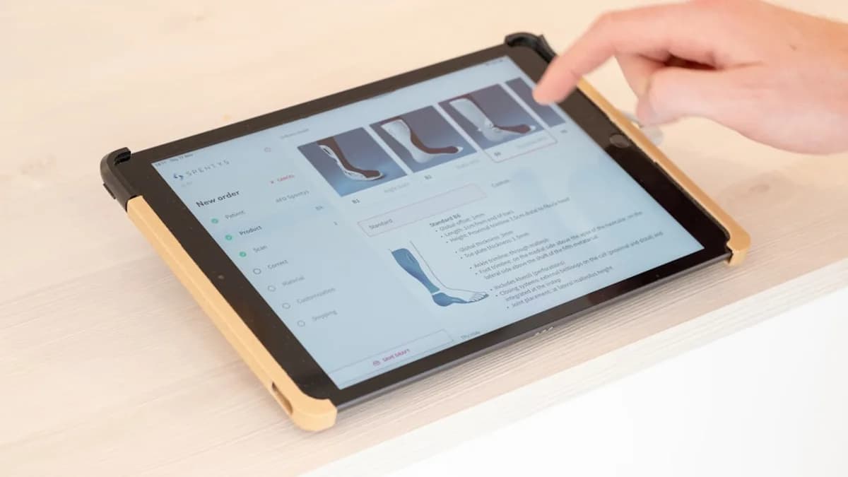 a person touching the screen of a tablet