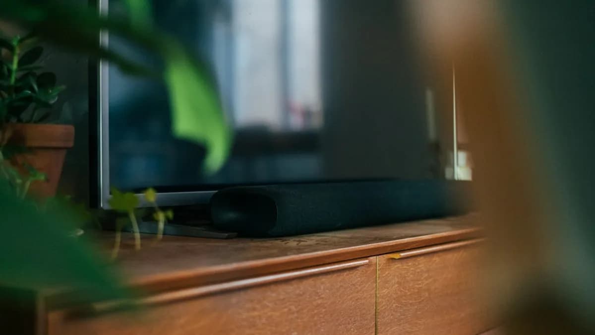 black flat screen tv on brown wooden table