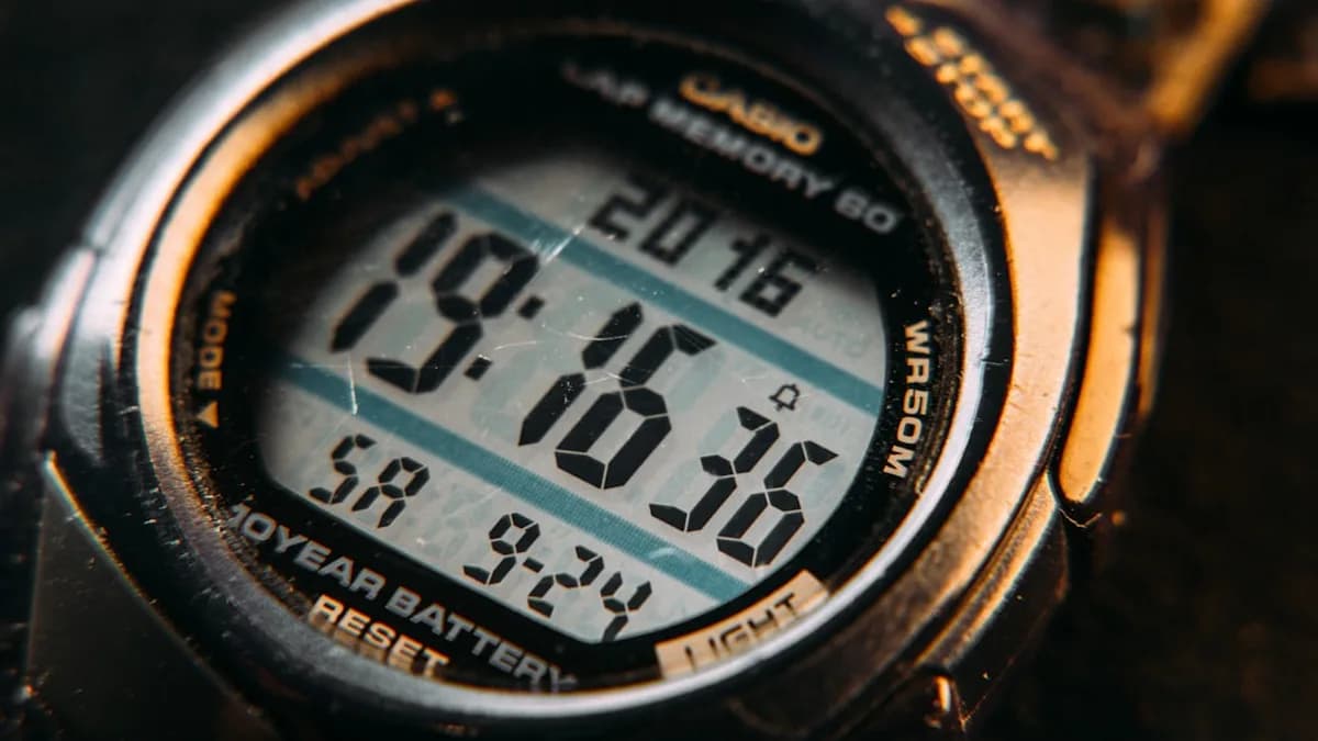 black and gray digital watch at 10 00