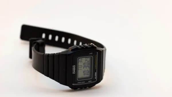 black casio digital watch at 11 00