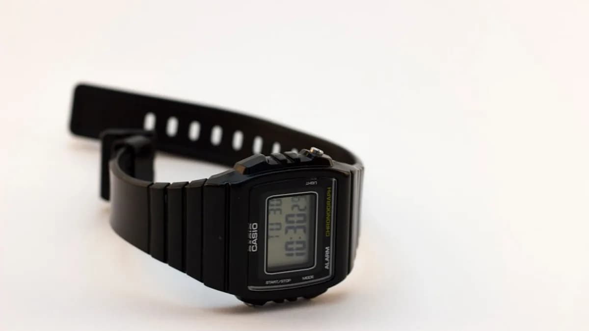 black casio digital watch at 11 00