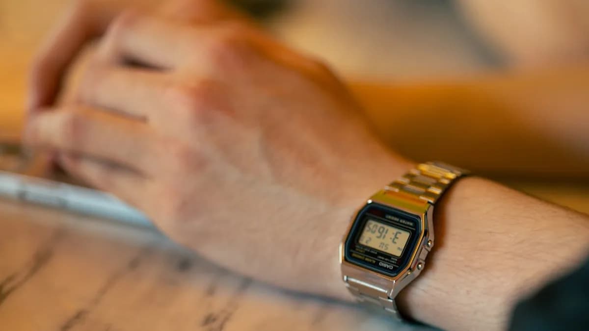 Close-up of a person wearing a digital watch
