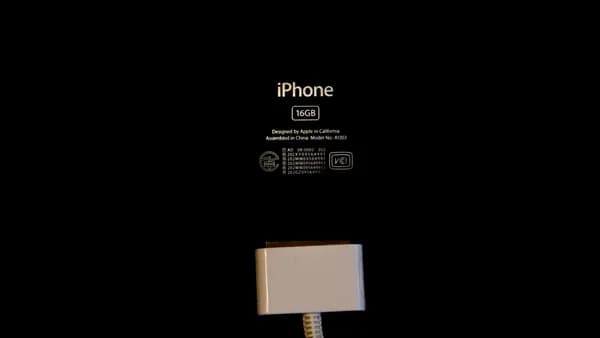 an iphone is plugged in to a charger