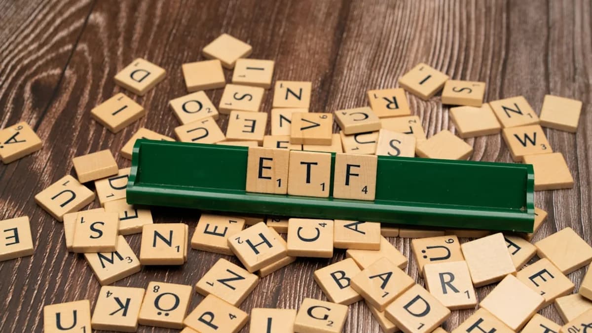 scrabble tiles spelling out letters on a wooden table