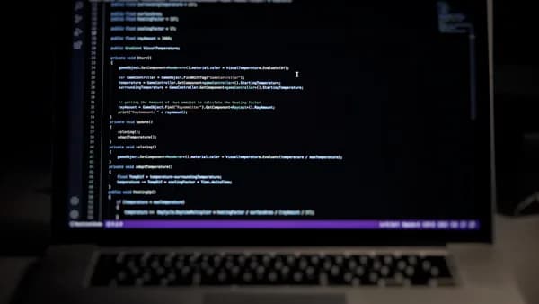 a laptop computer sitting on top of a desk