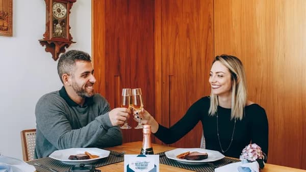 man and woman sitting at table