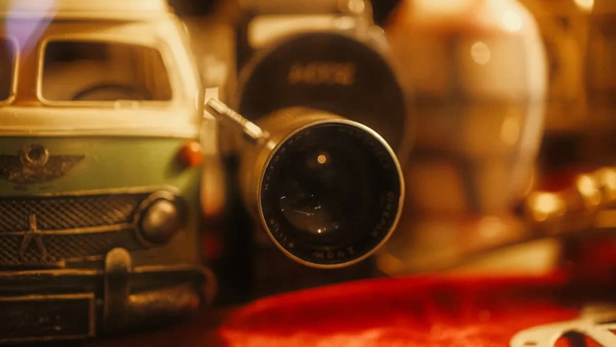 Close-up of vintage camera lens with toys