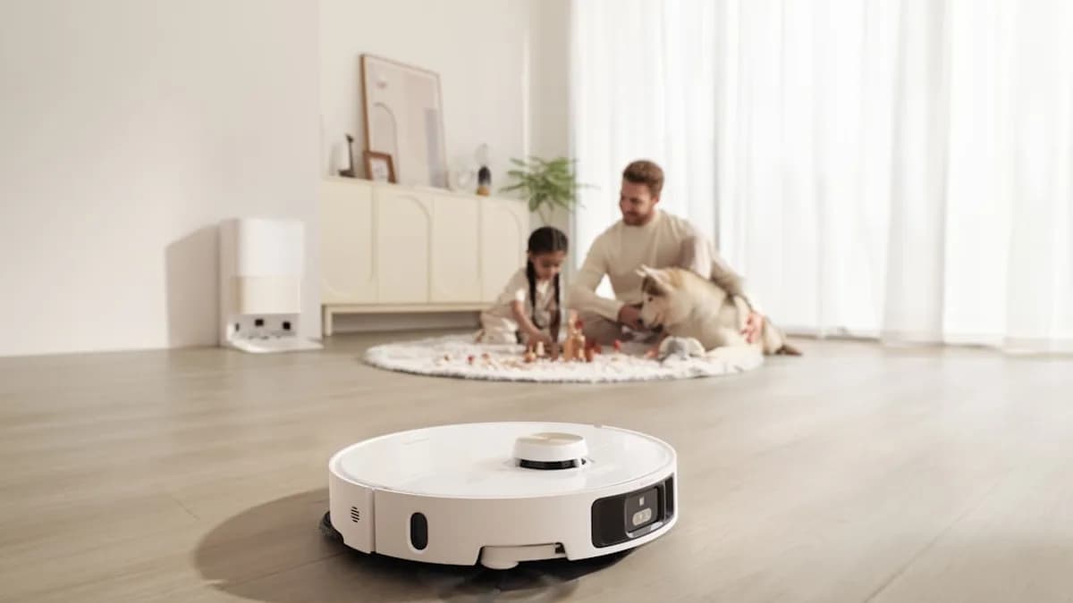 Robot vacuum cleans floor while family relaxes