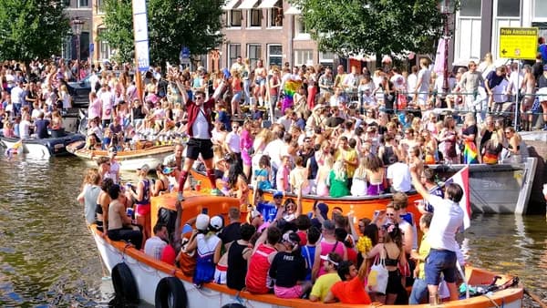 a large crowd of people on a boat
