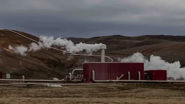 a red building with steam coming out of it
