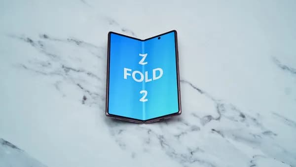 a blue sign on a white surface