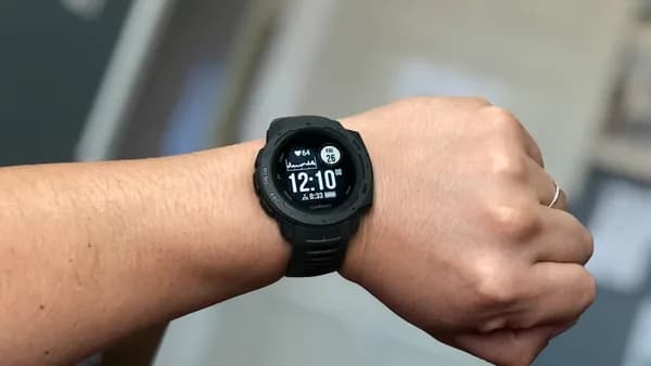 person wearing black digital watch